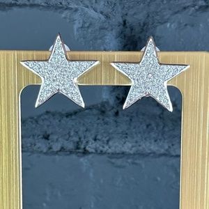 KENNETH JAY LANE silver crystal clip-on star earrings.